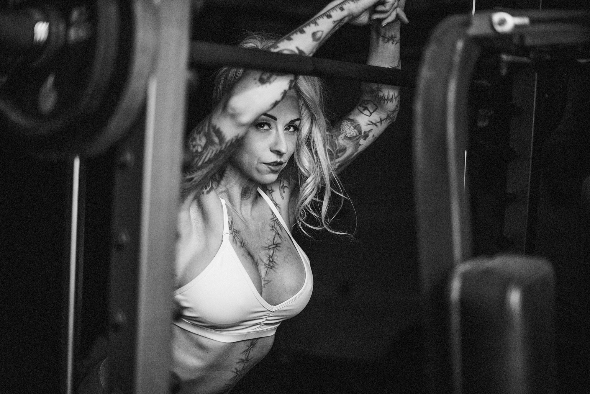 Jaime Leona exercising in a home gym with dumbbells